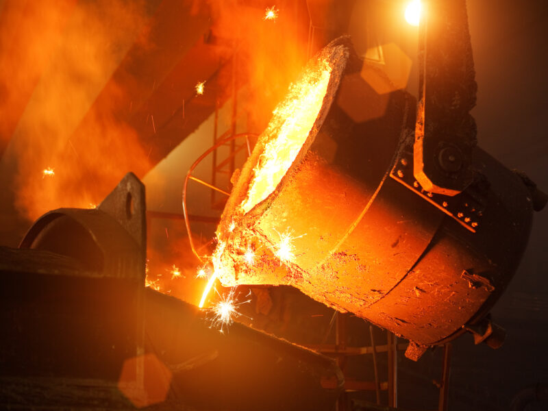 Pouring molten steel in the foundry